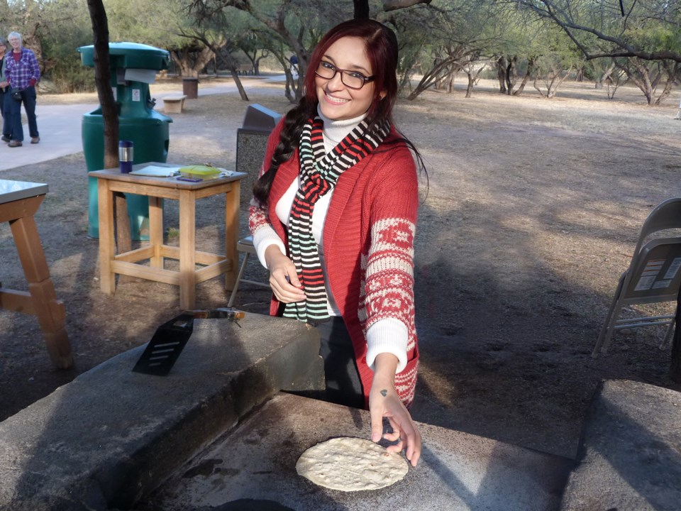 Mayra Cortinas, tortilla demonstrator, about to flip a tortilla on the comal.