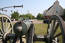 The monument at Tupelo National Battlefield is nestled among a more modern and busy landscape.