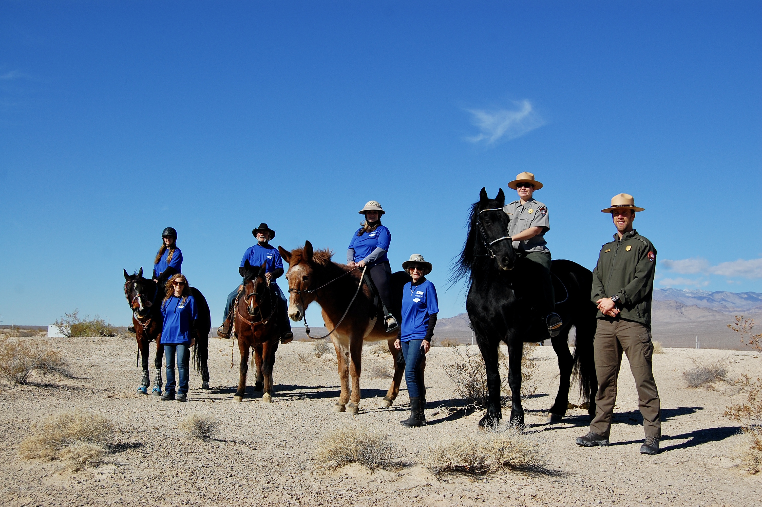 Tule Springs Fossil Beds National Monument Volunteer Mounted Horse Patrol on horseback with the Las Vegas Range in the background.