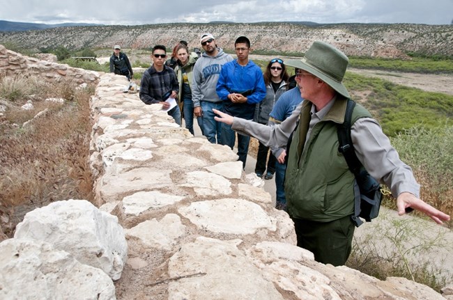 A park ranger gives a guided walk to visitors