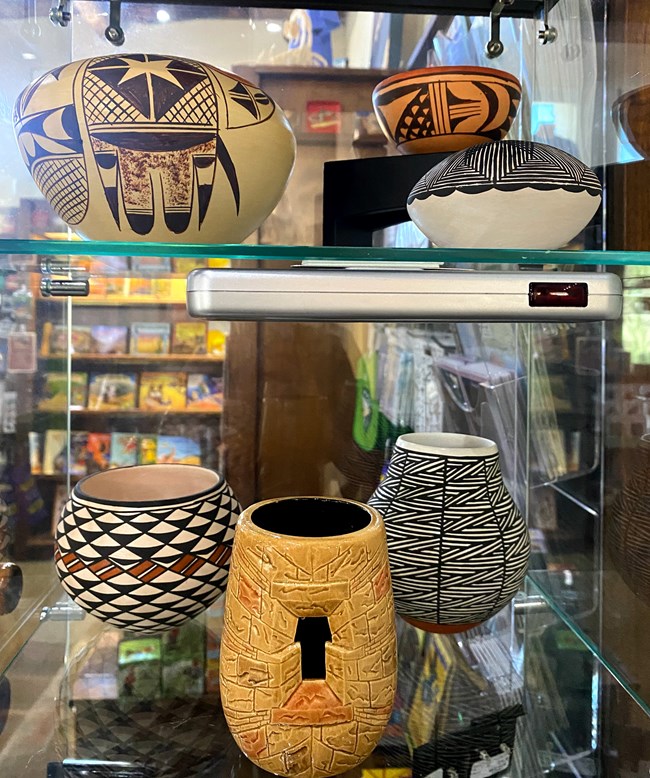 Hopi (top left) and Acoma pottery (bottom) available for sale at the WNPA park store.