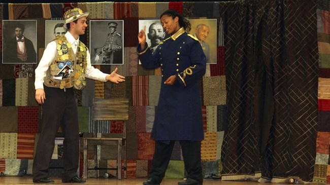 Lift Every Voice play with two actors on stage, one dressed as a Junior Ranger