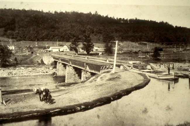 Canal Boat crossing the historic Roebling Bridge