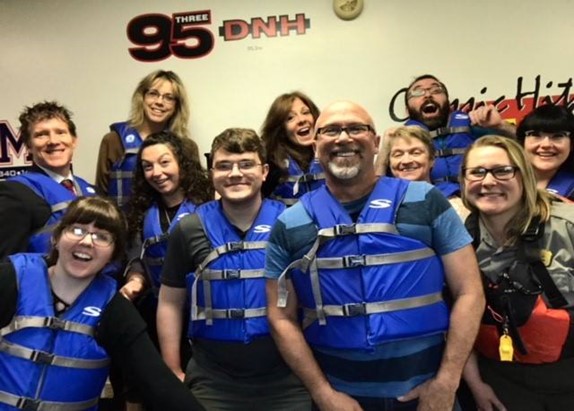 Picture2 Group of people wearing blue life jackets