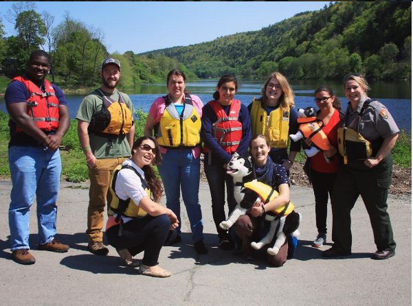 Rangers wearing their life jackets in front of the Delaware River.