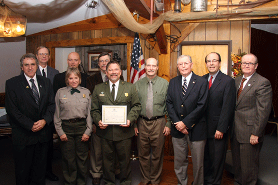 Superintendent Vidal Martinez accepts a Certificate of Congressional Recognition