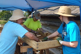 Volunteers screening for artifacts at the 2013 excavation site Volunteers screening for artifacts at the 2013 excavation site