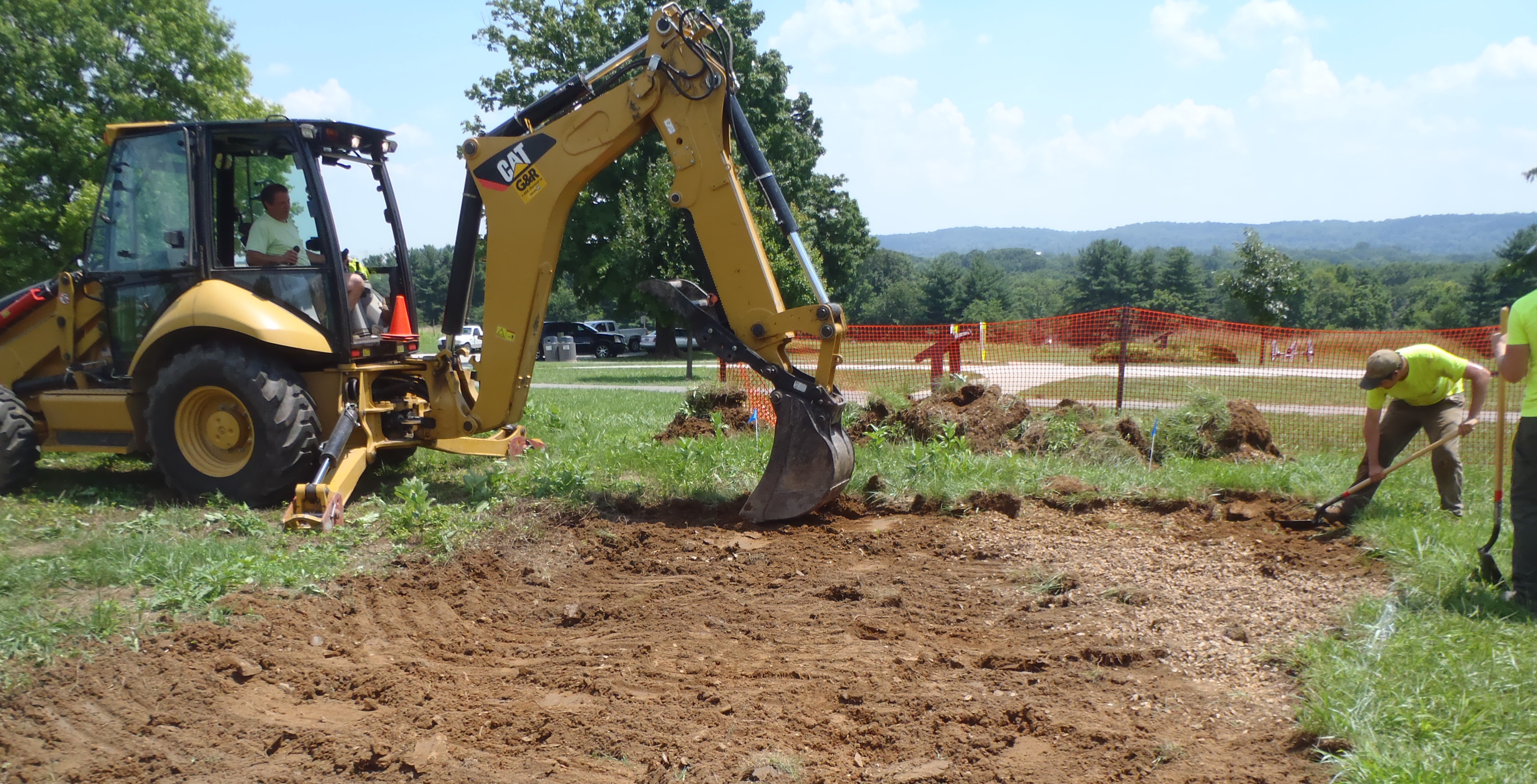 Archaeologists work to shovel scrape an area that to check the depth of the the backhoe's scrape. Archaeologists work to shovel scrape an area that to check the depth of the the backhoe's scrape.