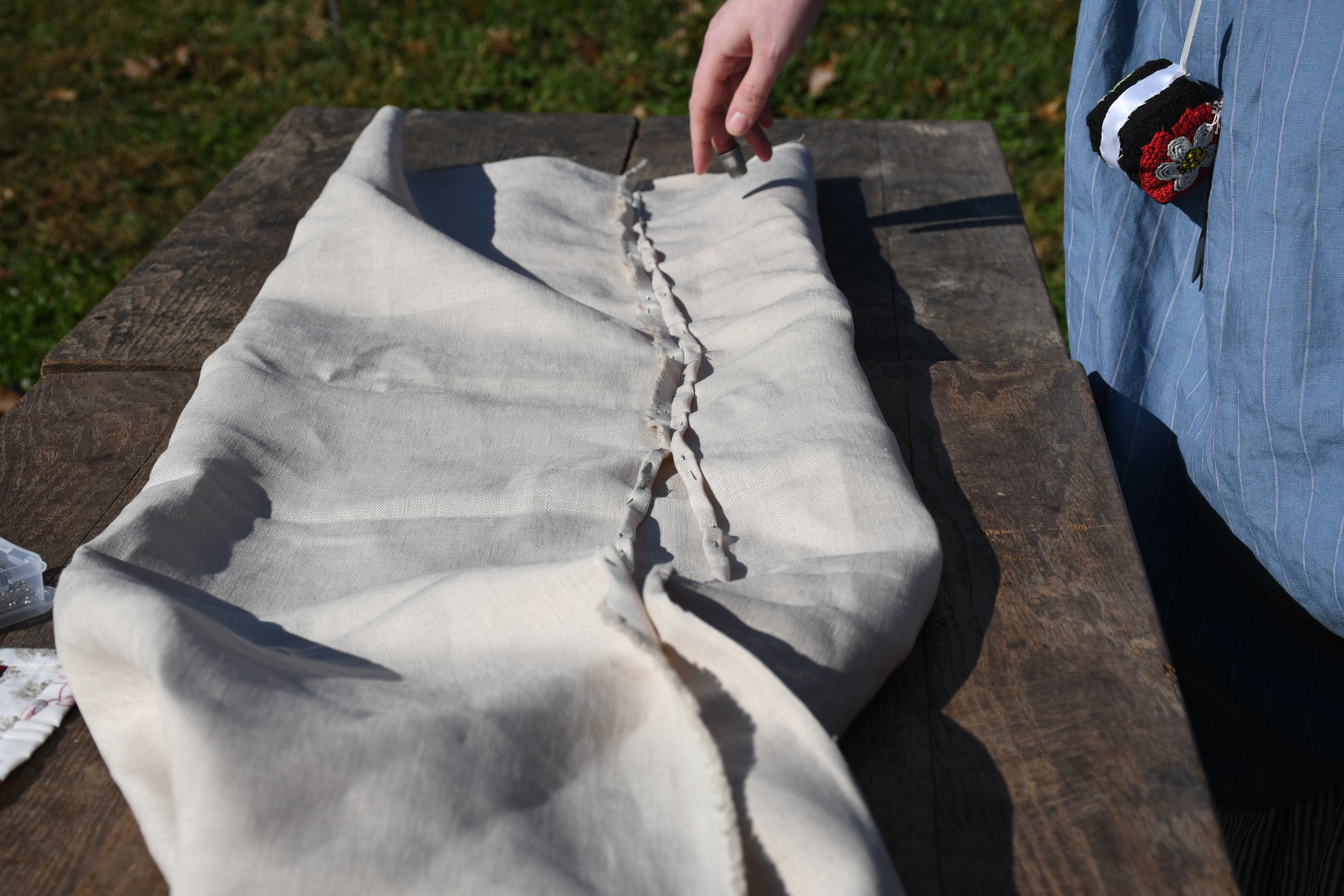 photograph, outdoors, a fully pinned interior hem