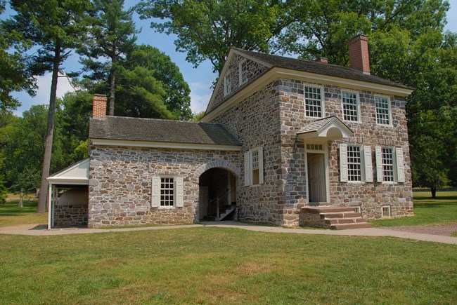 outdoors, grass, trees, stone house