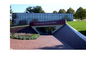 A brick pathway leading past a garden and up to the front doors of the Welcome Center. A brick pathway leading past a garden and up to the front doors of the Welcome Center.