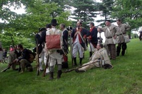 soldiers group together for a rest after a program