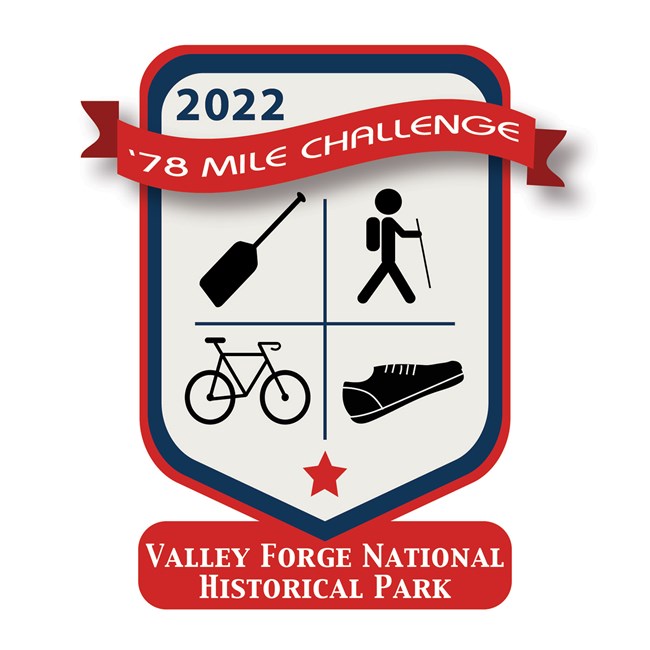 A hand holds up a red, white, and blue graphic with text that reads 2022 '78 Mile Challenge, Valley Forge National Historical Park, and icons arranged by quadrant. A paddle in the top left, a hiker figure in the top right, a bicycle in the bottom left, an