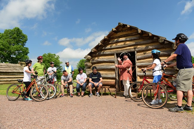 outdoors, bicycles, log cabin