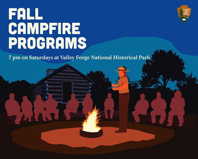 A park ranger stands next to a fire. Silhouetted people sit on benches. A log hut is in the background.