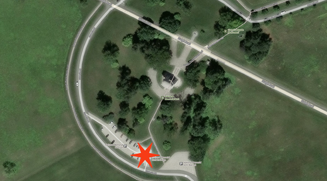 Aerial photo of National Memorial Arch area with red star in the parking lot marking the pick up drop off location