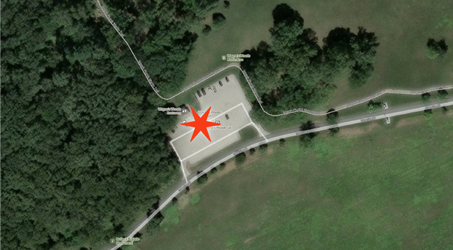 Aerial view of Waynes Woods area with red star in the parking lot next to the restroom marking the pick up drop off location