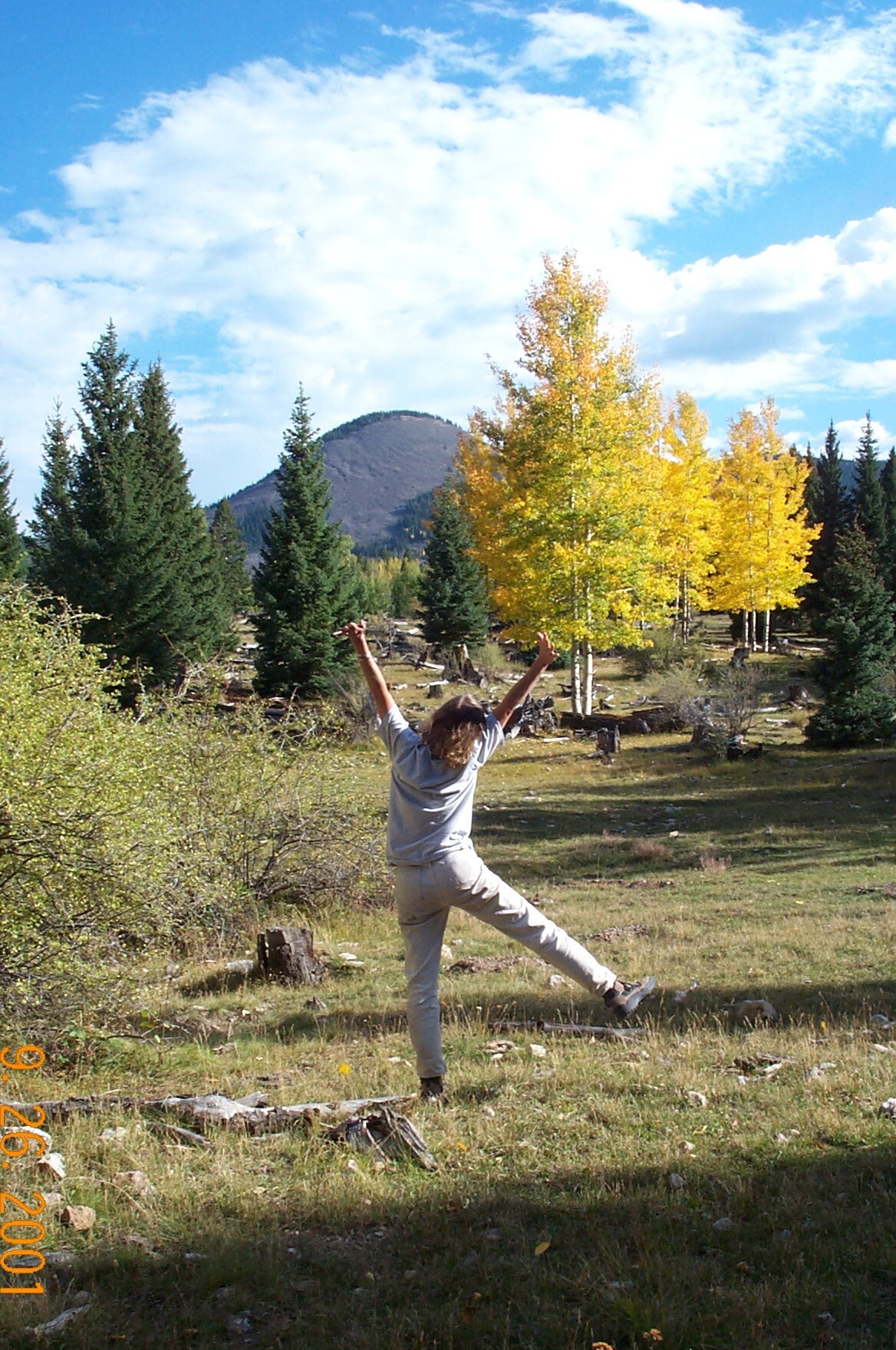 Ana jumping for joy A woman jumps into the air with her arms stretched high