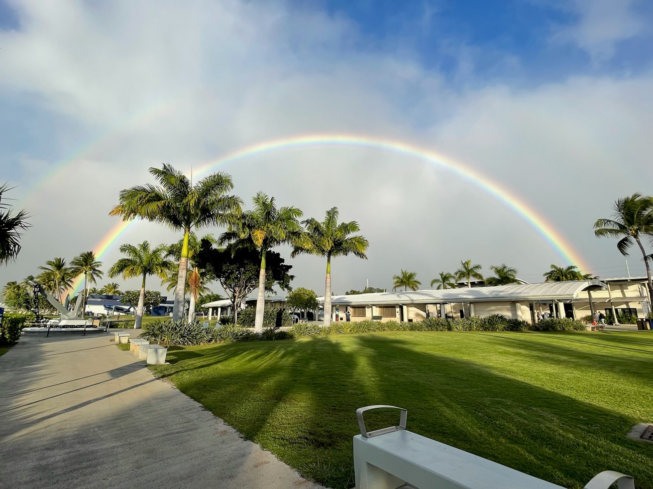 The Pearl Harbor National Memorial on an early morning day with a rainbow