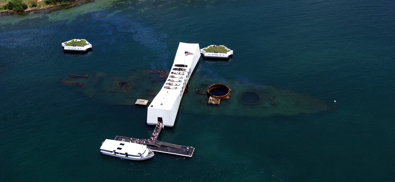 USS-Arizona-Memorial-US-Navy-photo-by-PH3-AW-SW-JAYME-PASTORIC-USN_1.jpg An aerial view of the USS Arizona and the memorial.
