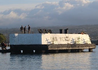 Soldiers stand at the USS Vestal Mooring Quay at Pearl Harbor.