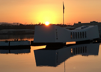 The USS Arizona Memorial and mooring quay at sunset.