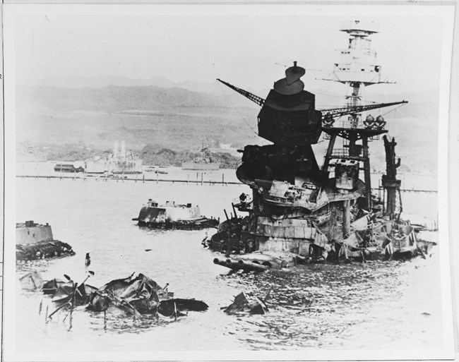 The mangled wreck of USS Arizona on December 10th.