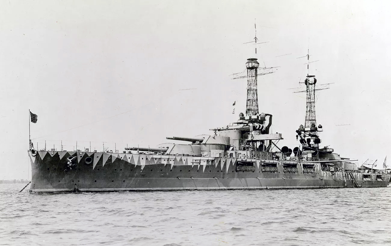 The USS OKlahoma, a large battleship, is seen at sea.