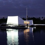 The USS Arizona Memorial at night.