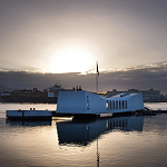 The USS Arizona Memorial at sunset.