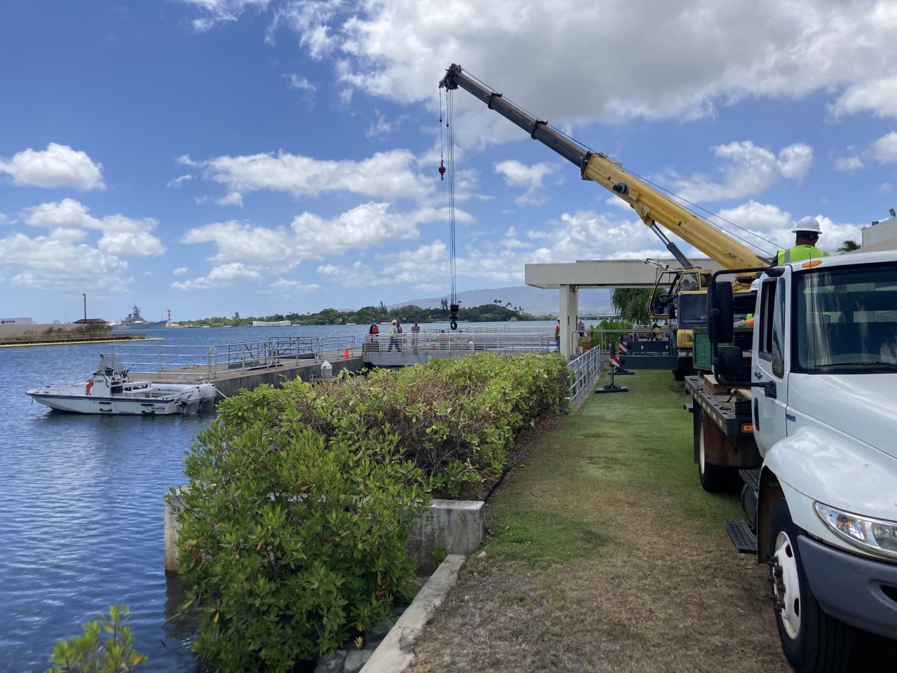 Shoreside Dock and NAVFAC Crane Looking out towards Pearl Harbor, in the foreground a vehicle based crane is parked along side the shoreside dock, as NPS and Navy staff assess the situation.