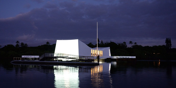 The USS Arizona lit up at night.