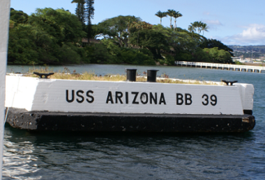 A white mooring quay that reads USS Arizona BB 39