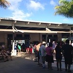 Visitors at Aloha Court, near the ticket desk.