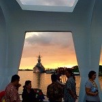 The Battleship Missouri, seen from the USS Arizona Memorial at sunset.