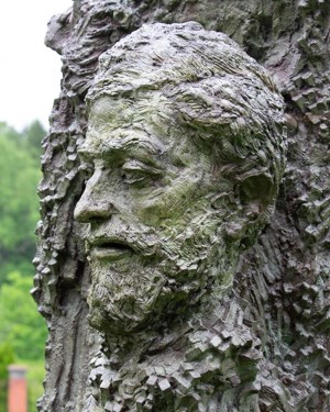 A bronze bust of a male head and shoulders.