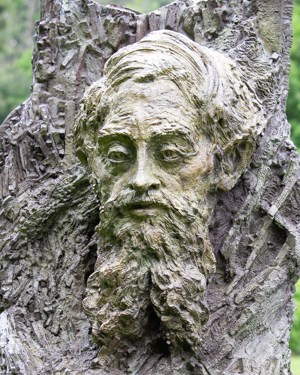A bronze bust of a male head and shoulders.