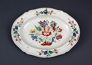 A porcelain platter painted with floral decoration.