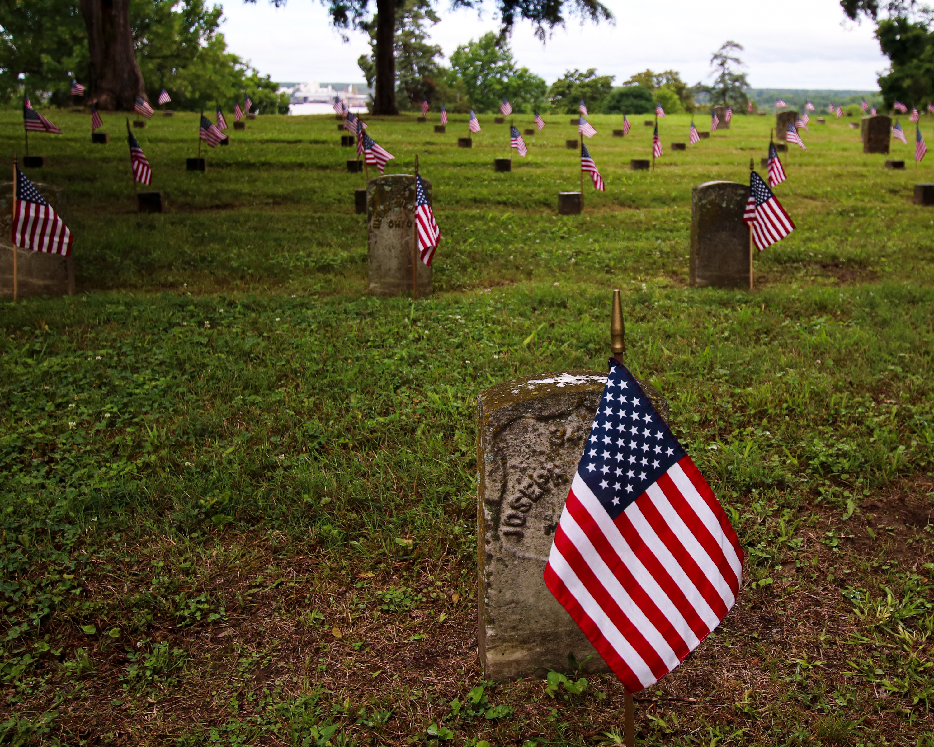 Vicksburg National Cemetery American flags placed next to headstones