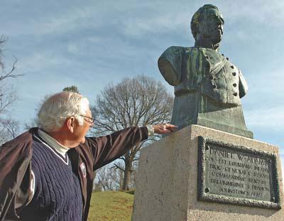 Executive director Harry McMillin of the newly formed Friends of the Vicksburg National Military Park and Campaign points out a bust of Confederate Col. Daniel W. Adams as an example of a monument in need of cleaning.