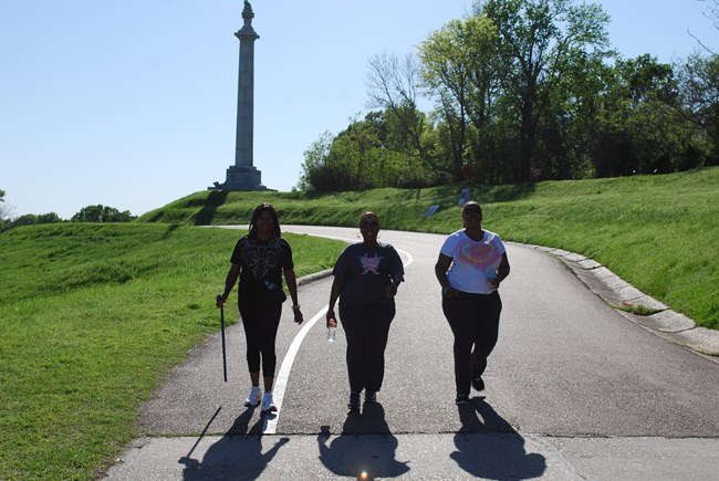 walkers on the tour road