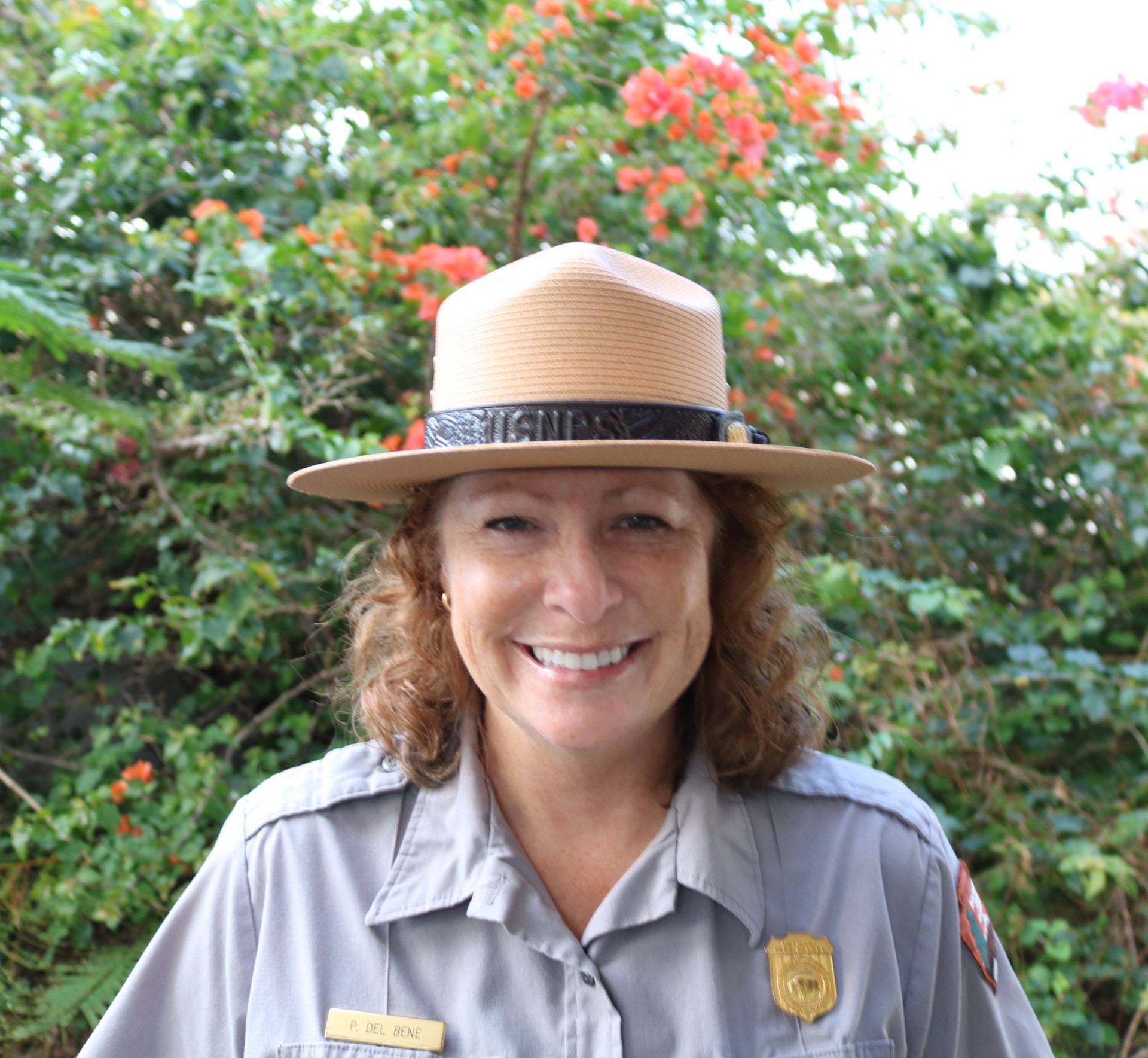 Smiling woman wearing a ranger hat
