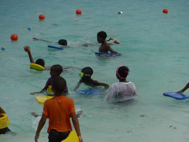 YCC assisting with swimming class
