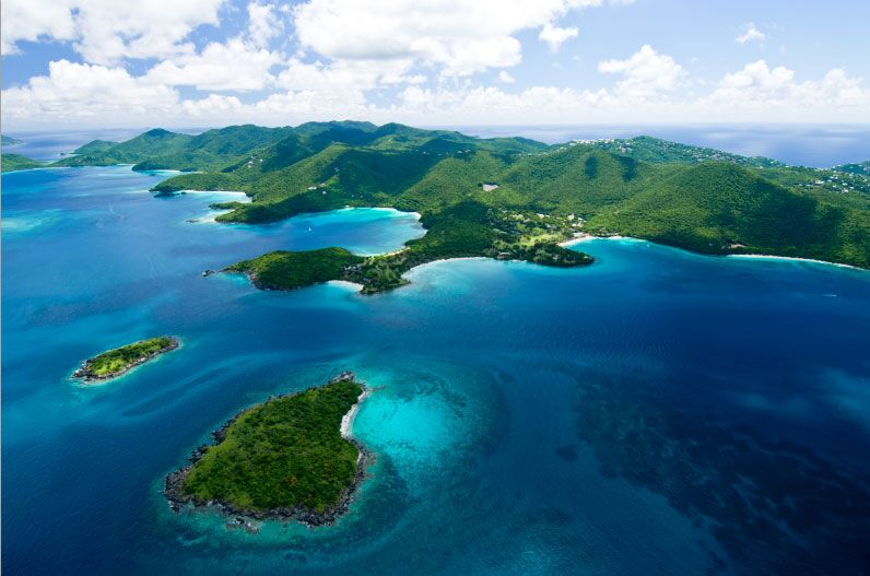Honeymoon and Hawksnest Beaches at Virgin Islands National Park Deep green coastline and islands surrounded by dark blue waters