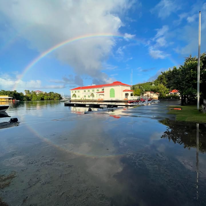 VIIS VC Rainbow_PaulaSmail Cruz Bay Visitor Center with Rainbow and Reflection