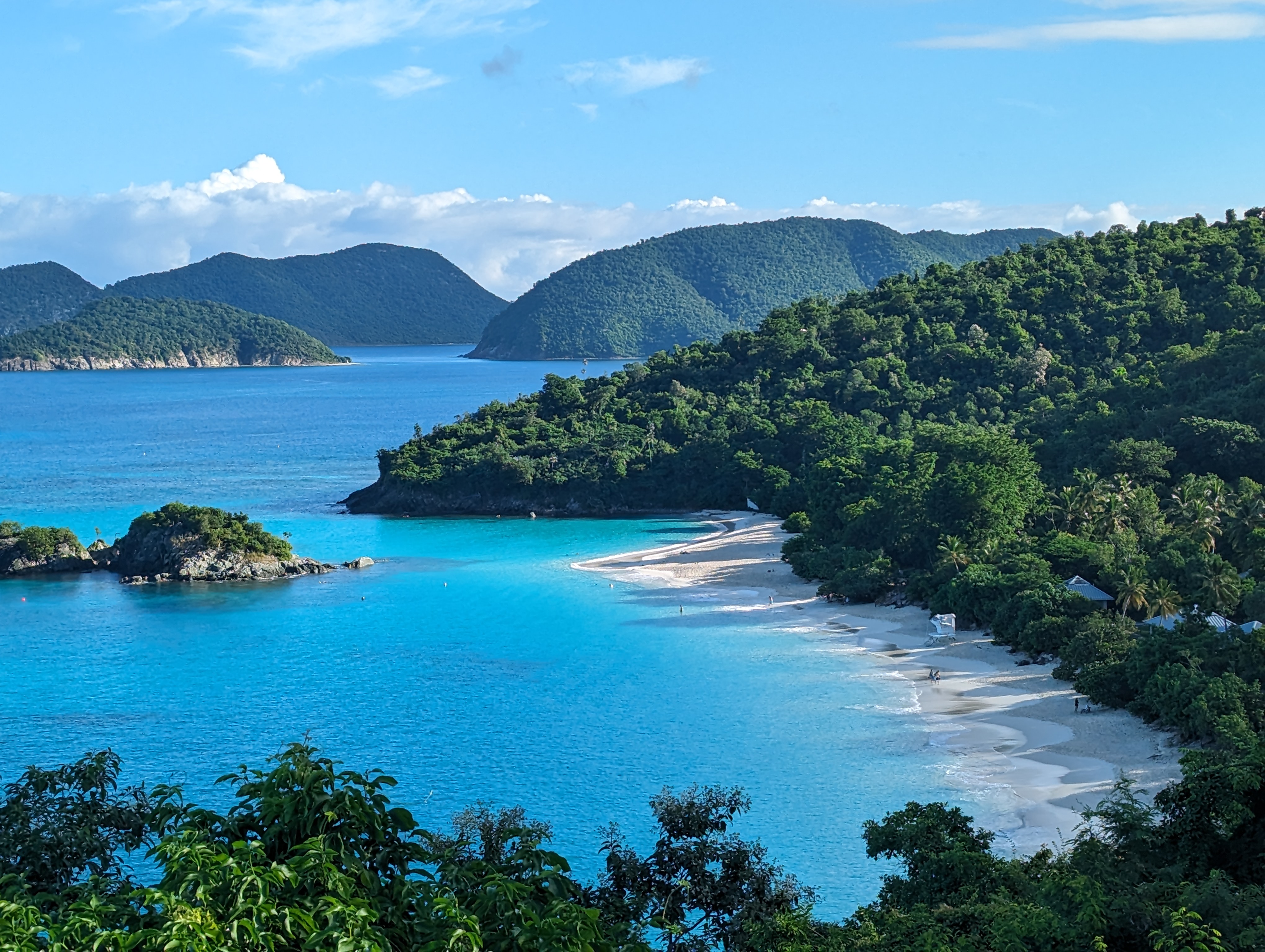 Trunk Bay Image of Trunk Bay with white sand, blue water and blue sky.