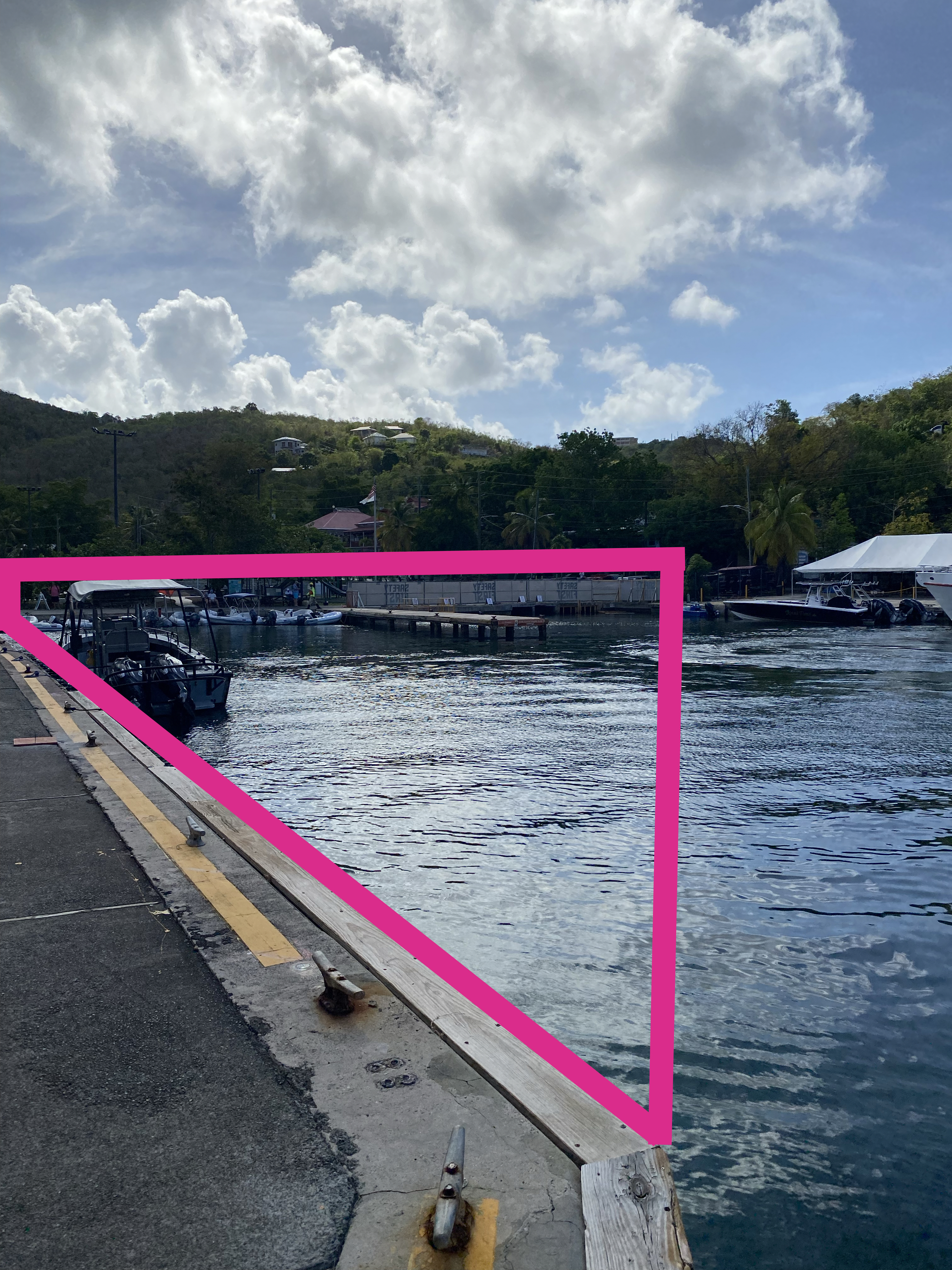 The area in Cruz Bay Creek outlined in pink will be closed to the public beginning Tuesday, May 23, 2023. The NPS bulkhead and finger pier in Cruz Bay Creek are shown with drawn lines outlining the area to be closed by a turbidity boom.