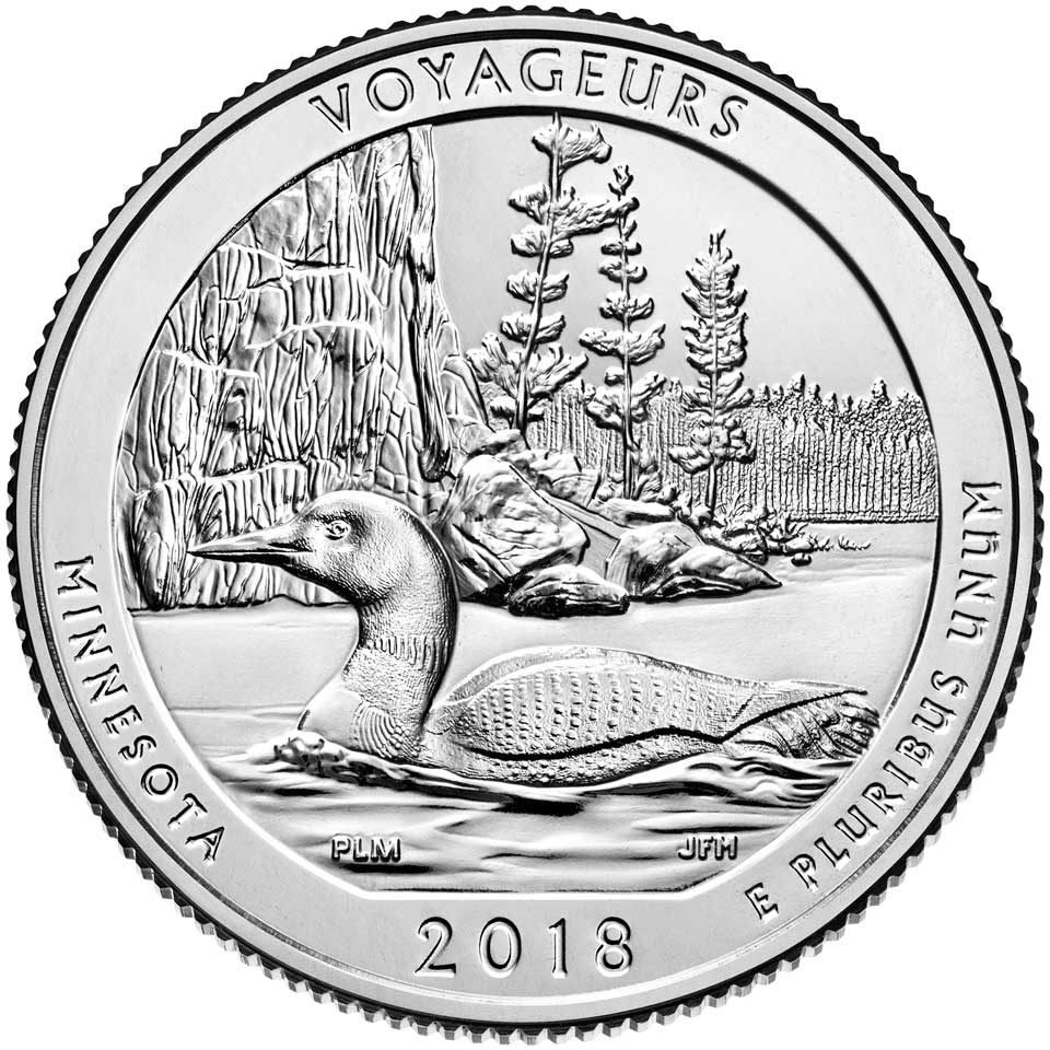 Image of quarter, outline of loon in foreground with cliffs and trees in background