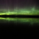 The northern lights shine in the night sky The northern lights shine in the night sky
