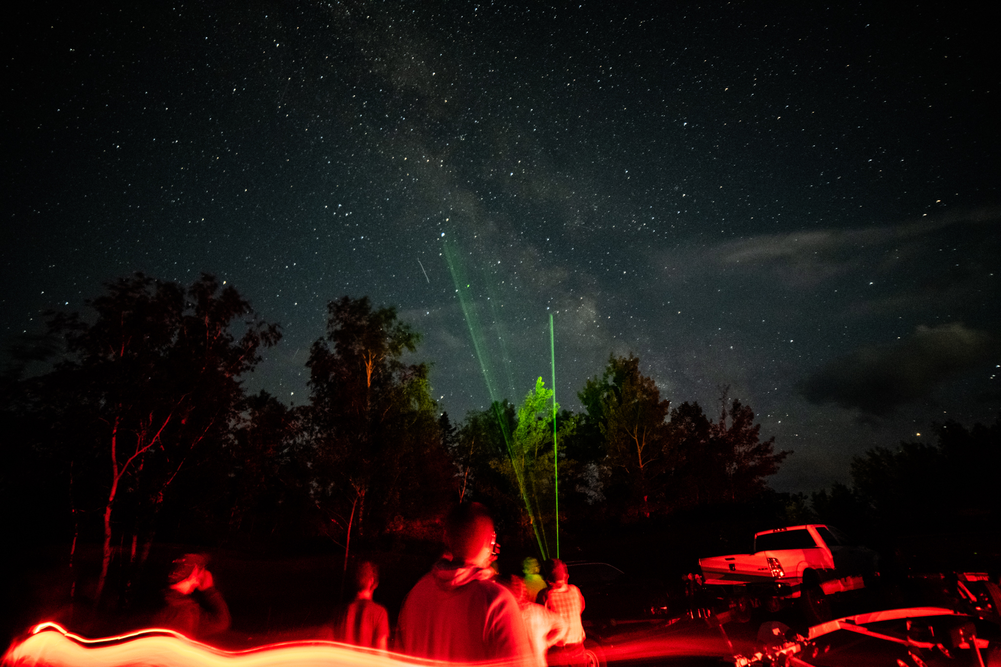 Star Party Constellation Tour Green lasers pointing up into a star filled night sky